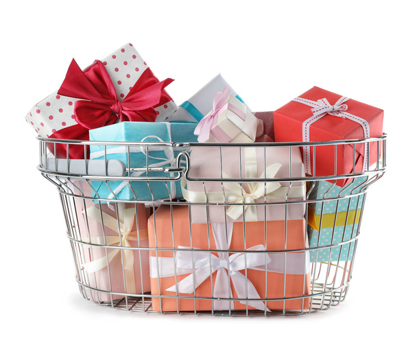 Shopping basket full of gift boxes on white background - Foto, Imagem