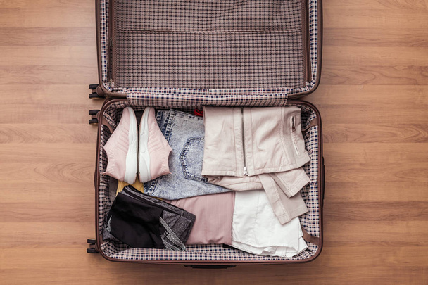 Top view of packed a luggage or suitcase for journey. - 写真・画像