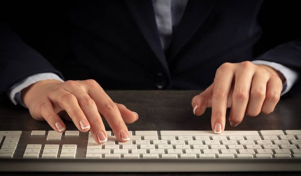Woman typing on keyboard - Photo, Image