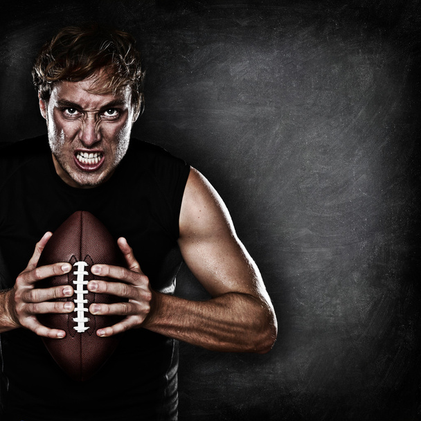 Football player portrait holding american football - Photo, Image