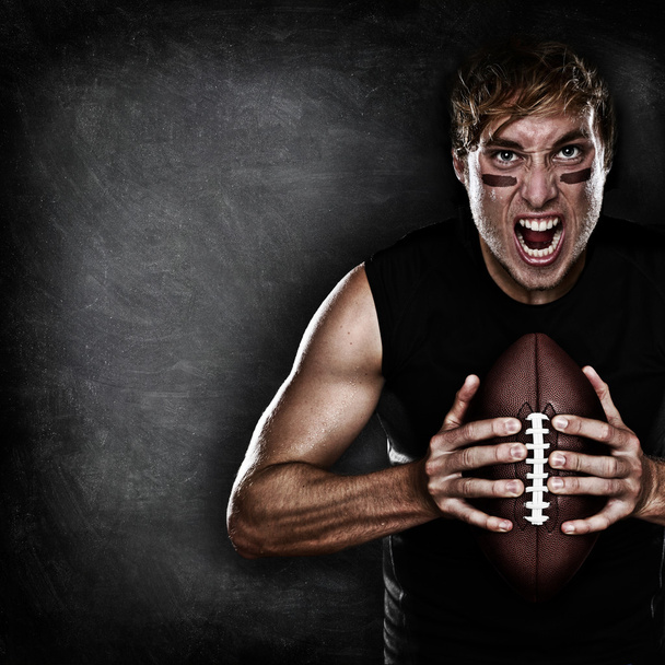 Football player aggressive with american football - Photo, Image