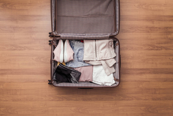 Top view of packed a luggage or suitcase for journey. - 写真・画像
