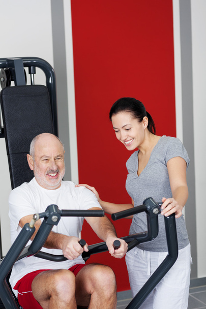 Personal fitness trainer with a senior man - Fotoğraf, Görsel