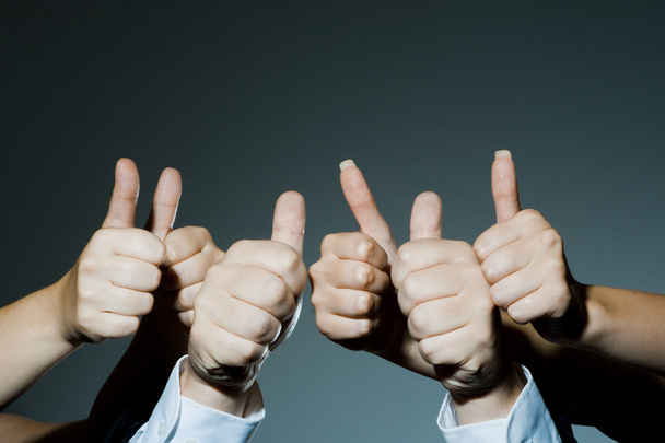 Group holding thumbs up - Photo, image