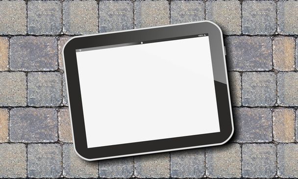 Tablet pc op straatstenen - Foto, afbeelding