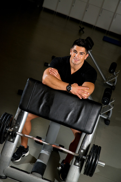 Man is smiling and looking at the camera in gym - Fotografie, Obrázek