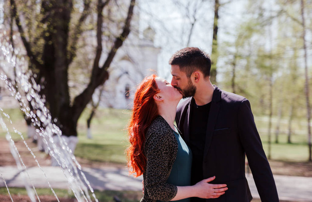 Portrait of   beautiful young couple in   spring park. - Фото, зображення