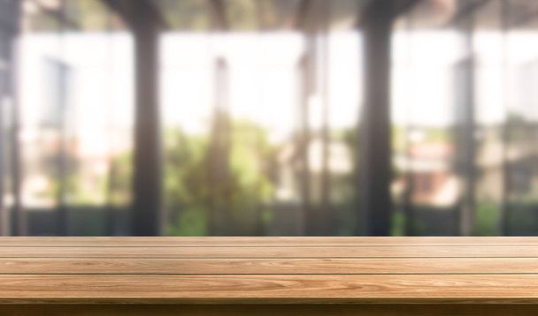 Wood table in city center modern office background - Photo, Image