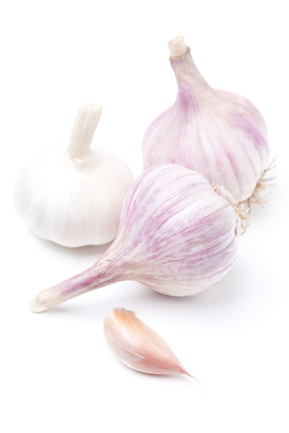 Three bulbs of garlic isolated on white, selective focus - Zdjęcie, obraz