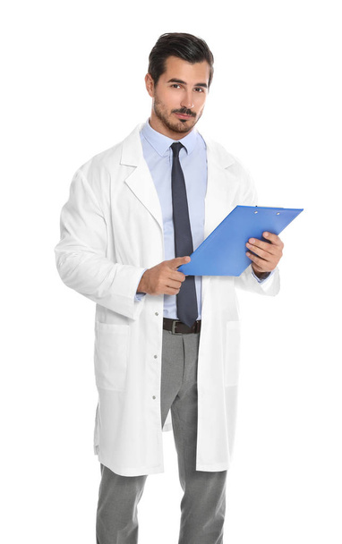 Young male doctor with clipboard on white background. Medical service - Foto, Bild