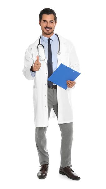 Young male doctor with clipboard on white background. Medical service - Foto, Imagen