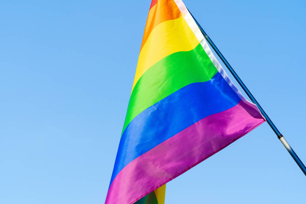 LGBT waving flag in the sky on flagpole - 写真・画像