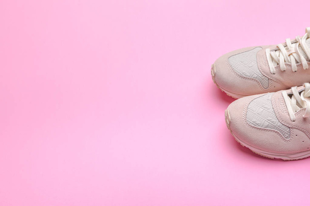 sneakers on pink background. - Fotó, kép