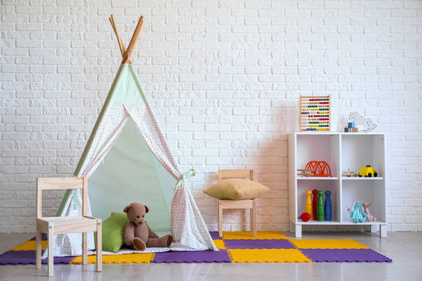 Stylish interior of modern playroom in kindergarten - Fotó, kép
