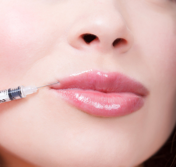 Beauty woman giving botox injections. - 写真・画像