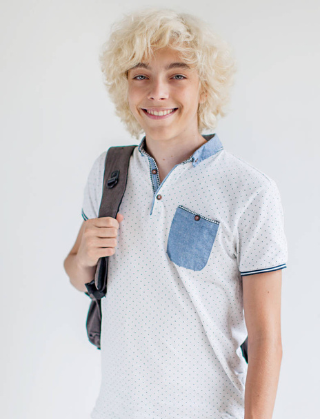Portrait of cheerful young blond man smiling looking at camera - Photo, Image