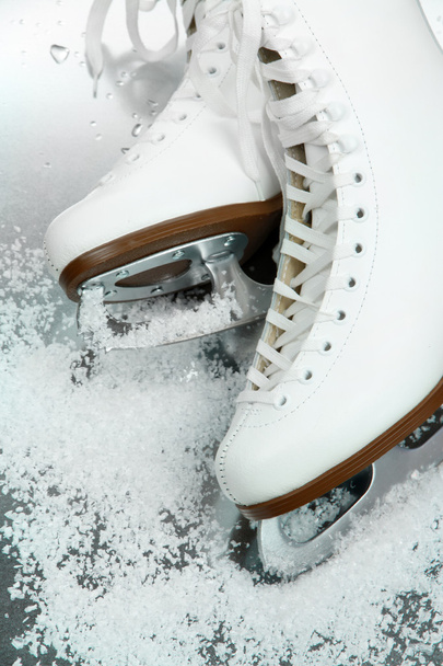 Figure skates in snow close-up - Фото, изображение