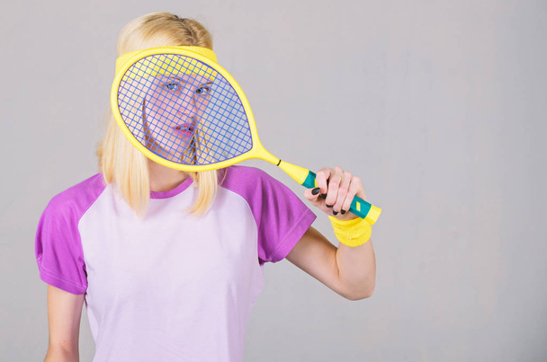 Sport for maintaining health. Athlete hold tennis racket in hand. Tennis club concept. Tennis sport and entertainment. Active leisure and hobby. Girl adorable blonde play tennis. Start play game - Zdjęcie, obraz