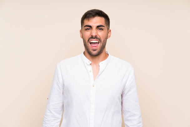 Handsome man with beard over isolated background with surprise facial expression - Photo, Image