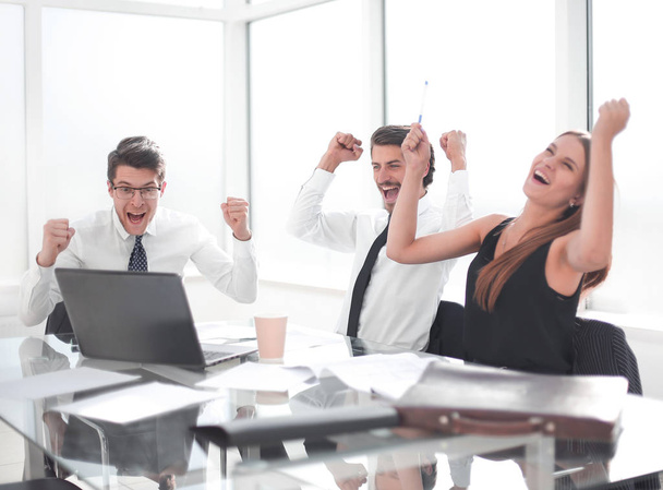 happy business team getting good news in the workplace - Фото, зображення
