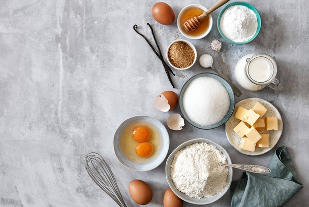 Baking ingredients: flour, eggs, sugar, butter, milk and spices - Zdjęcie, obraz