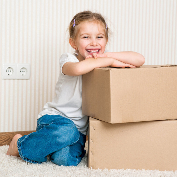 Little girl moving into new house - Photo, image
