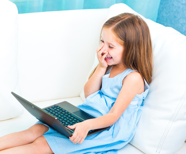 little cute girl with a laptop - Foto, immagini