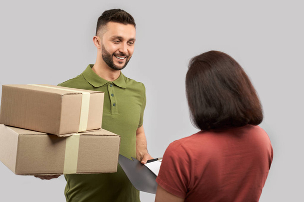 Delivery service, delivery man and client. - Fotó, kép