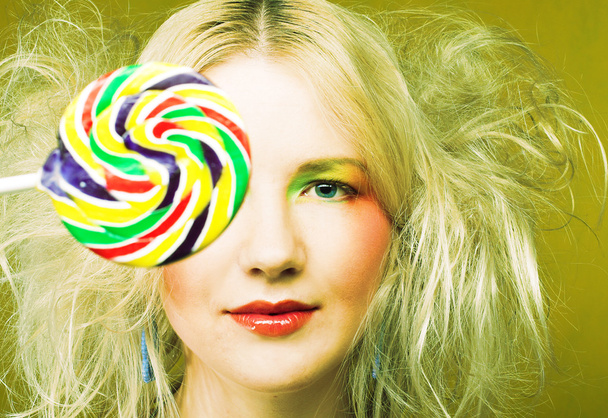 Girl with lollipop - Фото, изображение