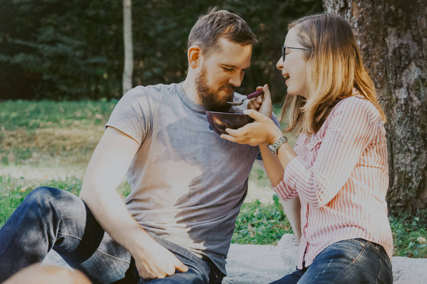 Cute happy couple on picnic - 写真・画像