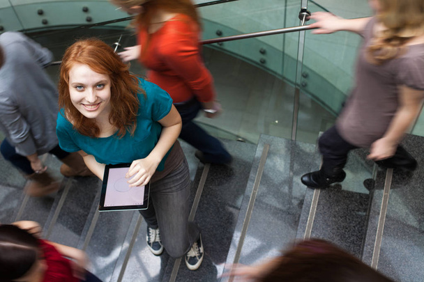 At the university/college - Students rushing up and down a busy  stairway - Фото, изображение