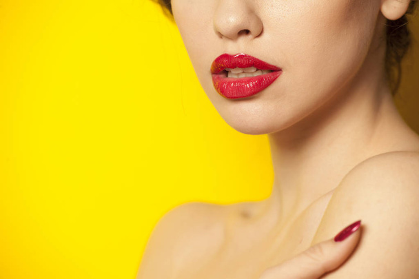red glossy lipstick on yellow background - Photo, Image