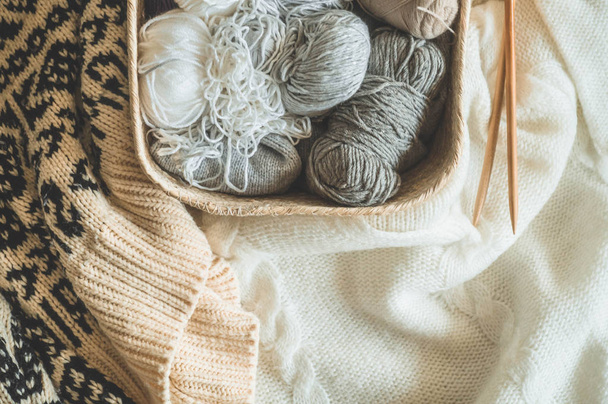 Thread for knitting in a basket closeup. Knitting as a hobby. Accessories for knitting - Zdjęcie, obraz