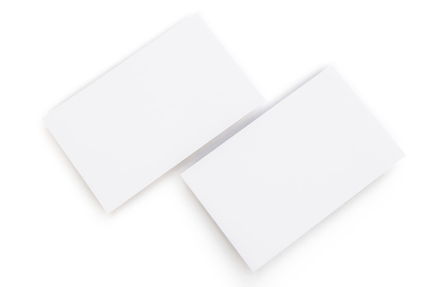 κενό επαγγελματικές κάρτες σε λευκό με διαδρομή αποκοπής - Φωτογραφία, εικόνα