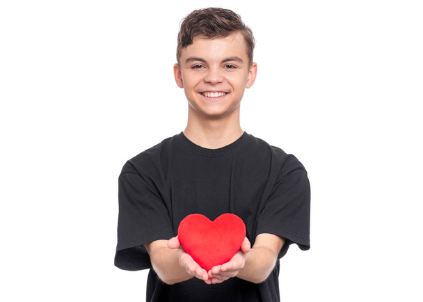 Teen boy with red heart - Foto, Bild