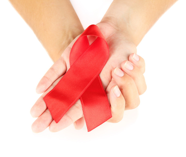 AIDS ribbon in hands isolated on white - Φωτογραφία, εικόνα