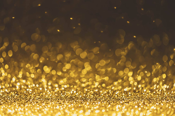 Gold glitter sparkle lights background. Defocused glitter abstra - Photo, Image