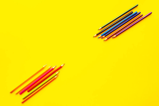 Color bright pencils on a yellow background. - Фото, зображення