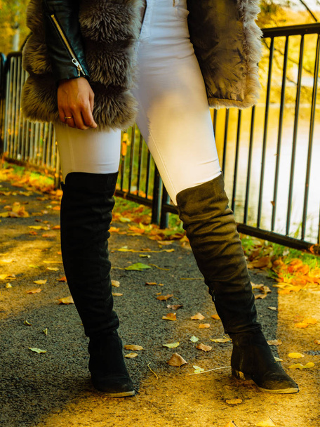 Woman wearing fur long vest during autumn - Fotó, kép