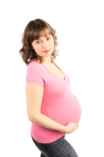 Young Pregnant Woman in Pink T-Shirt - Foto, imagen
