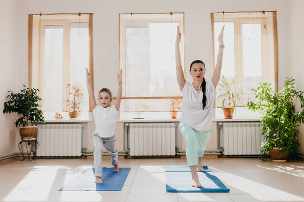 mom and daughter do yoga - Photo, image