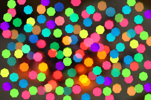 Christmas background.Glowing and festive colored light circles created from in camera - Zdjęcie, obraz