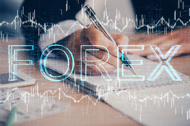 A woman hands writing information about stock market in notepad. Forex chart holograms in front. Concept of research. Multi exposure - Φωτογραφία, εικόνα
