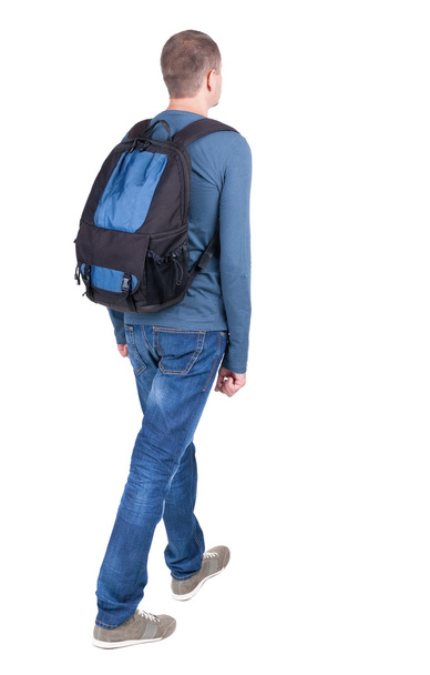 back view of walking man with backpack. - Valokuva, kuva