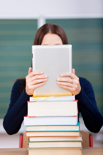 Woman with books and ipad touch - Photo, image