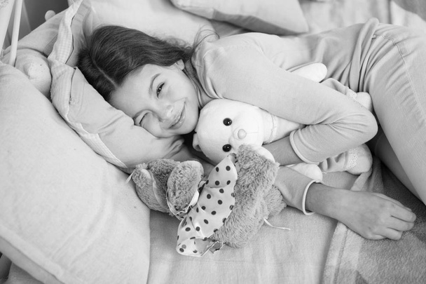 little child girl with xmas present. waiting for santa. Winter. small girl sleeping at home. christmas family holiday. happy new year. Christmas shopping. The morning before Xmas. Sleep - 写真・画像