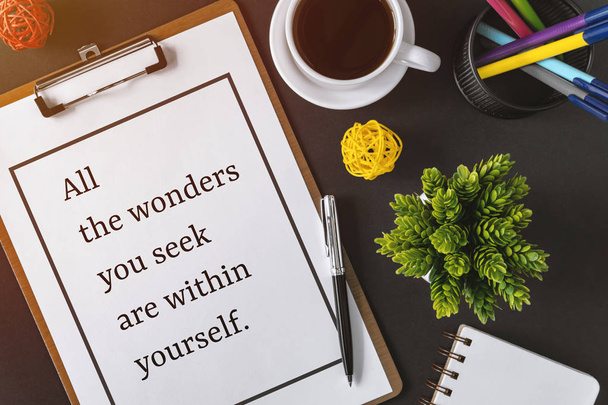 Inspirational and motivation life quote on clipboard with paper - All the wonders you seek are within yourself. - Photo, Image