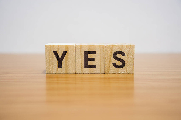 Yes Word on Wooden Block - Фото, изображение