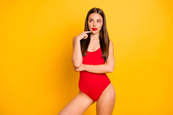 Portrait of her she nice-looking attractive lovely feminine lovable fascinating cute luxury sporty bewildered straight-haired lady perfect figure isolated over bright vivid shine yellow background - 写真・画像