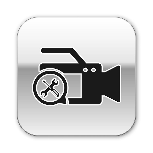 Caméra vidéo noire avec tournevis et icône clé isolée sur fond blanc. Réglage, entretien, réglage, entretien, réparation, fixation. Bouton carré argenté. Illustration vectorielle
 - Vecteur, image